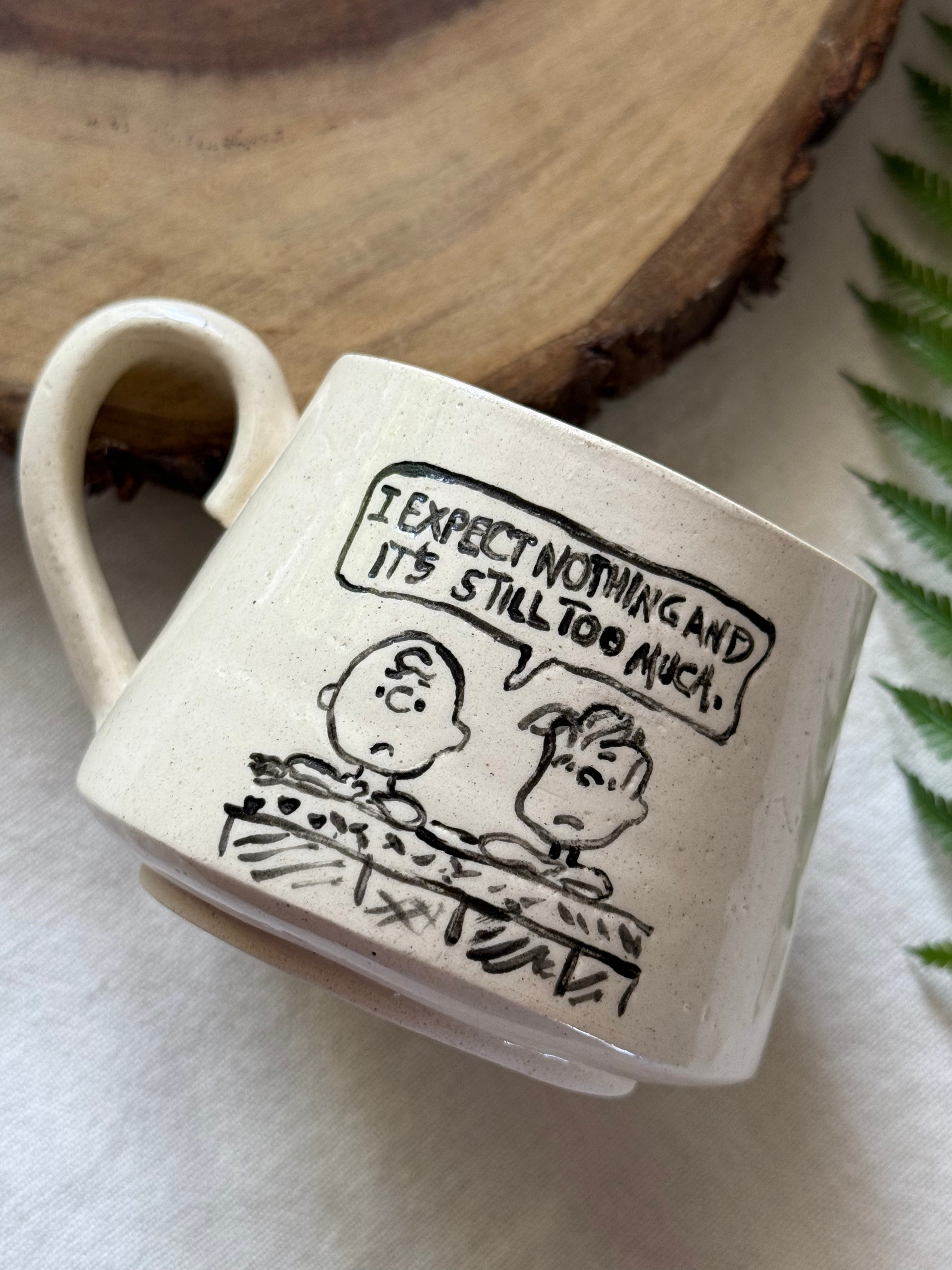 Charlie “Expect Nothing” Mug